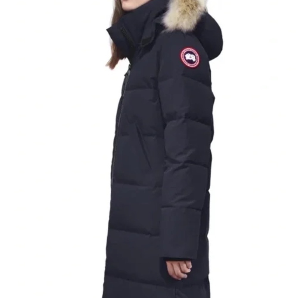 Mystique Down Parka in Navy Blue. Never worn, in perfect condition with fur hood